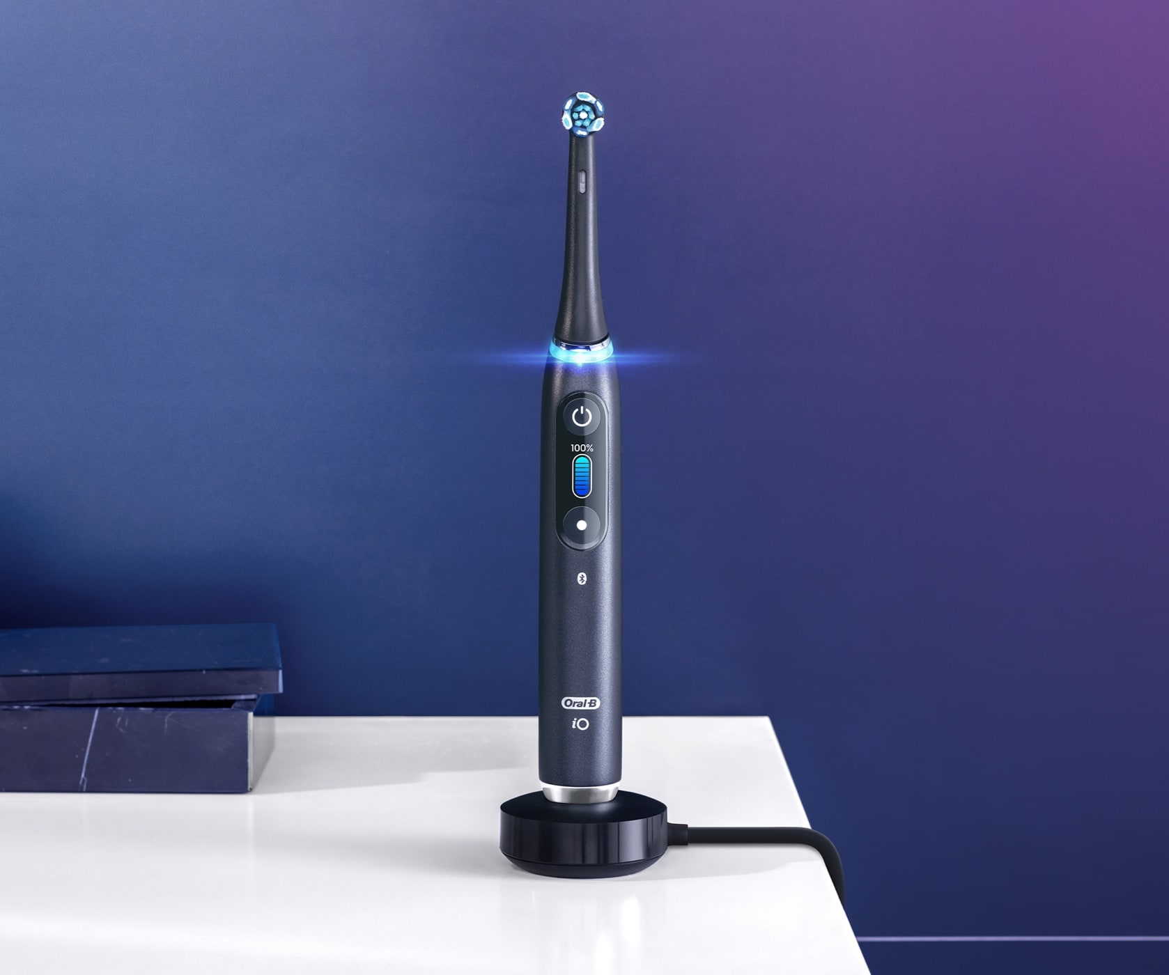 Black Oral-B iO9 electric toothbrush on magnetic charger undefined