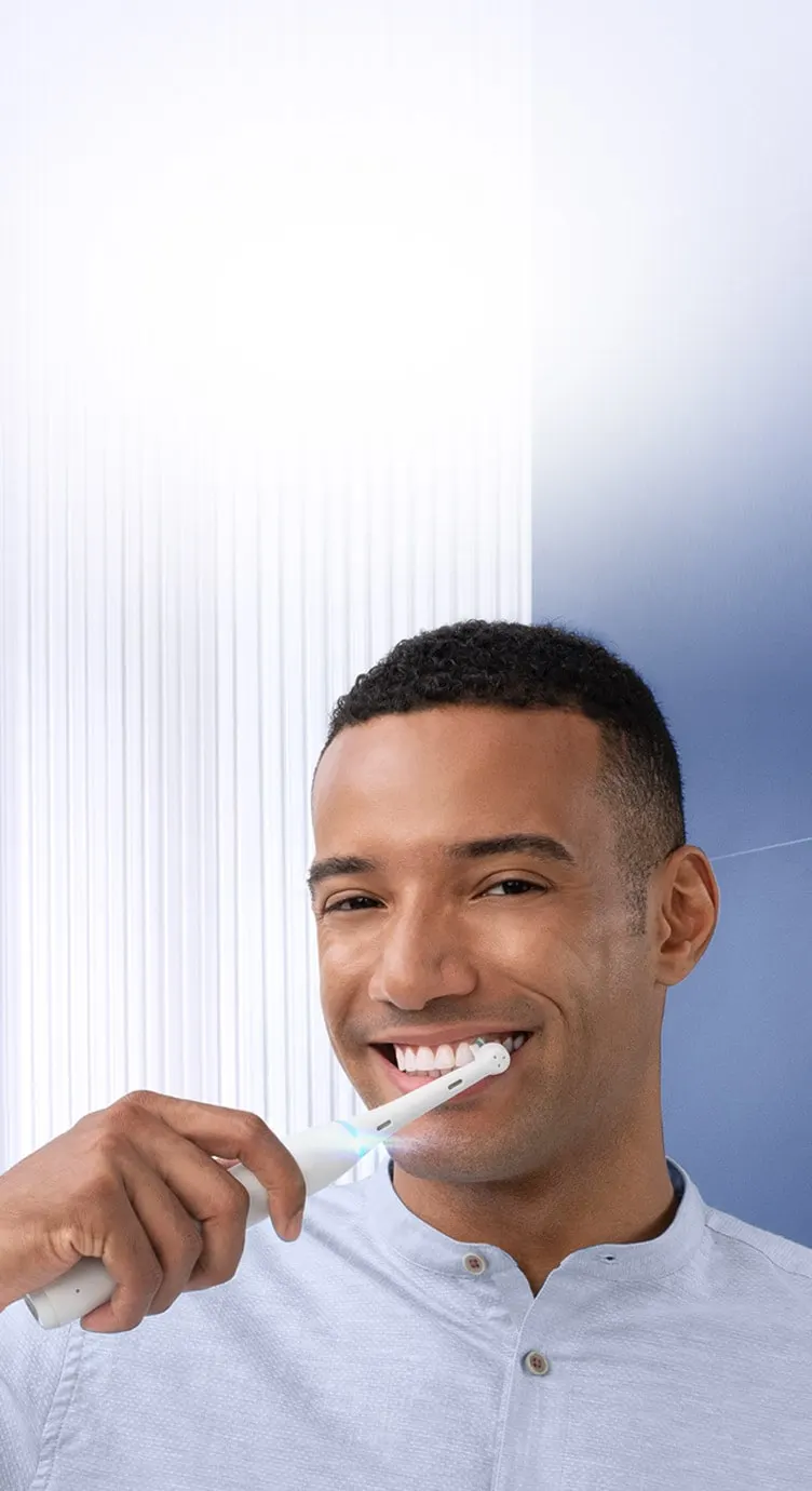 Man brushing with an Oral-B toothbrush undefined