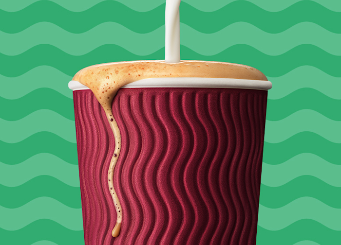Take away cup with coffee pour
