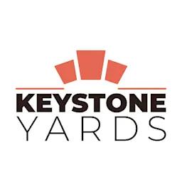 Logo of Keystone Yards with bold black and brown text and a stylized red keystone graphic.