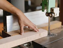 band saw cutting wood
