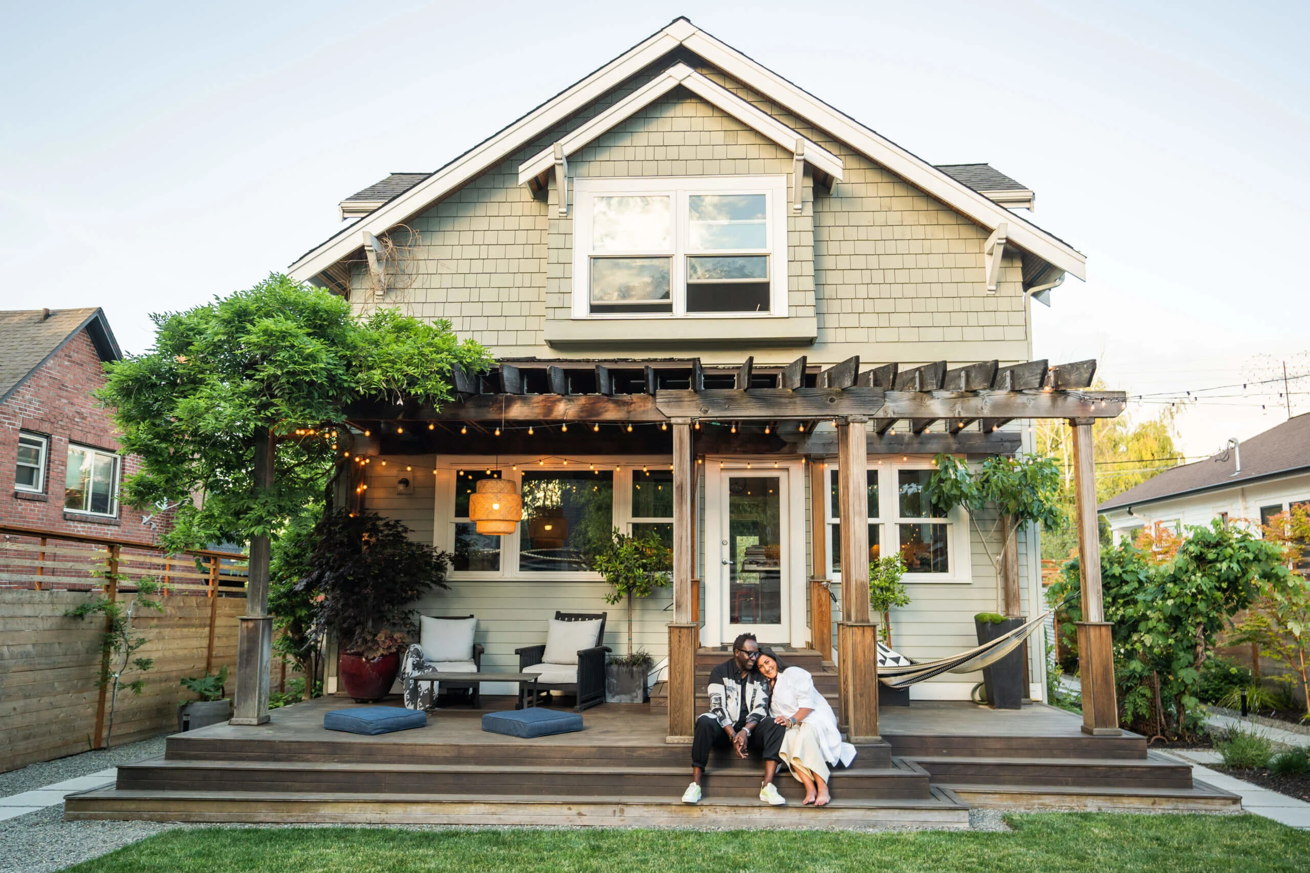 couple on steps under pergola