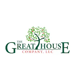 Logo of The Great House Company, LLC with green serif text and a tree graphic filled with red and green leaves.