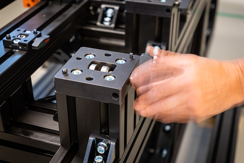 A close-up shot of the RapidLock and a blurred hand turning its locking mechanism.