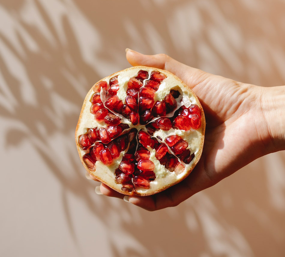 Pomegranate Can Against Blue Background