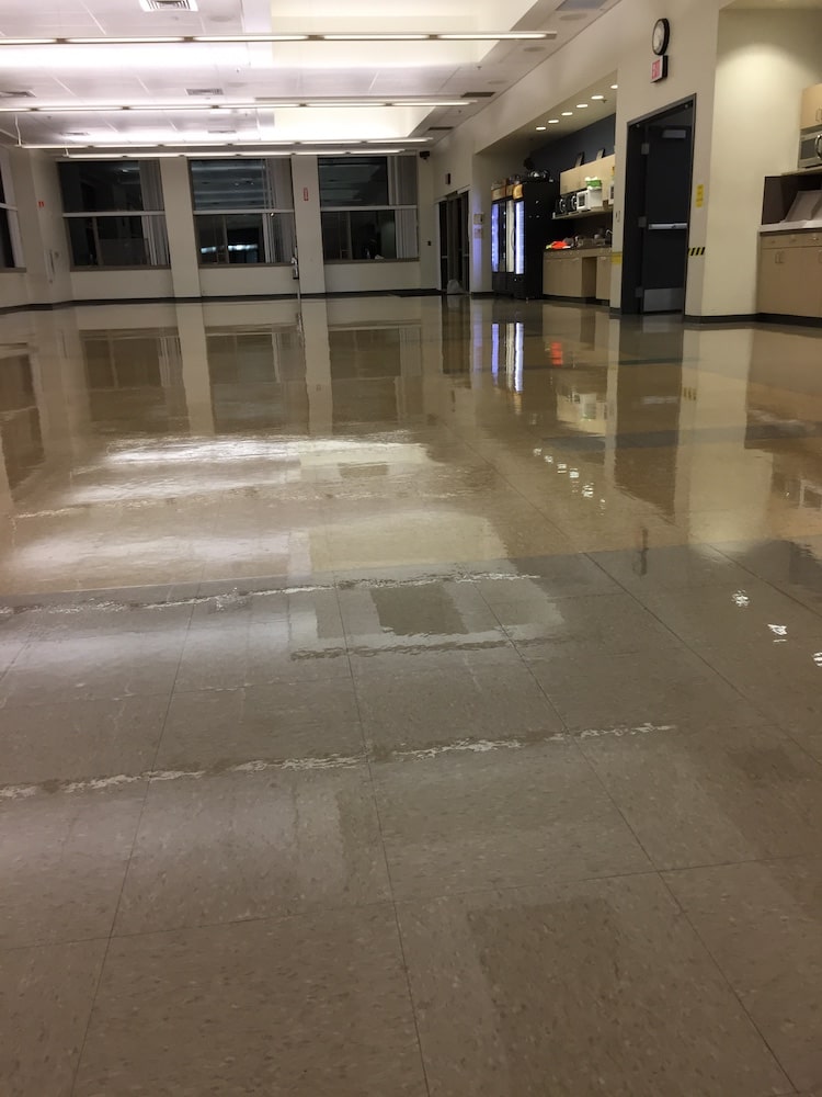 large room with shiny, reflective floor.