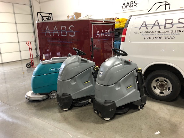 industrial floor polishers in warehouse.