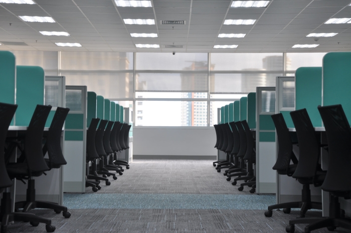 clean office carpet with cubicles and chairs.