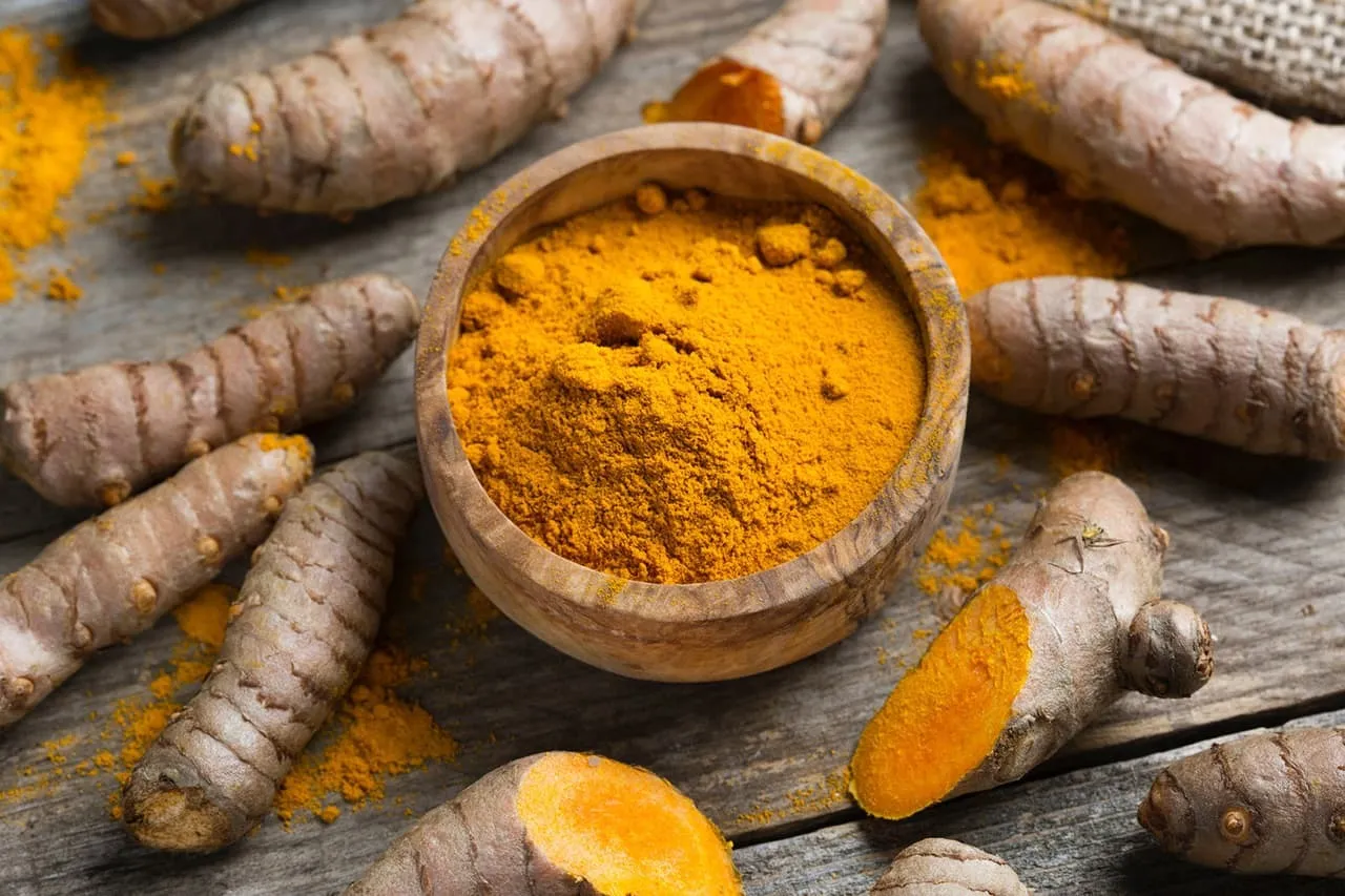 Ground turmeric root in a bowl