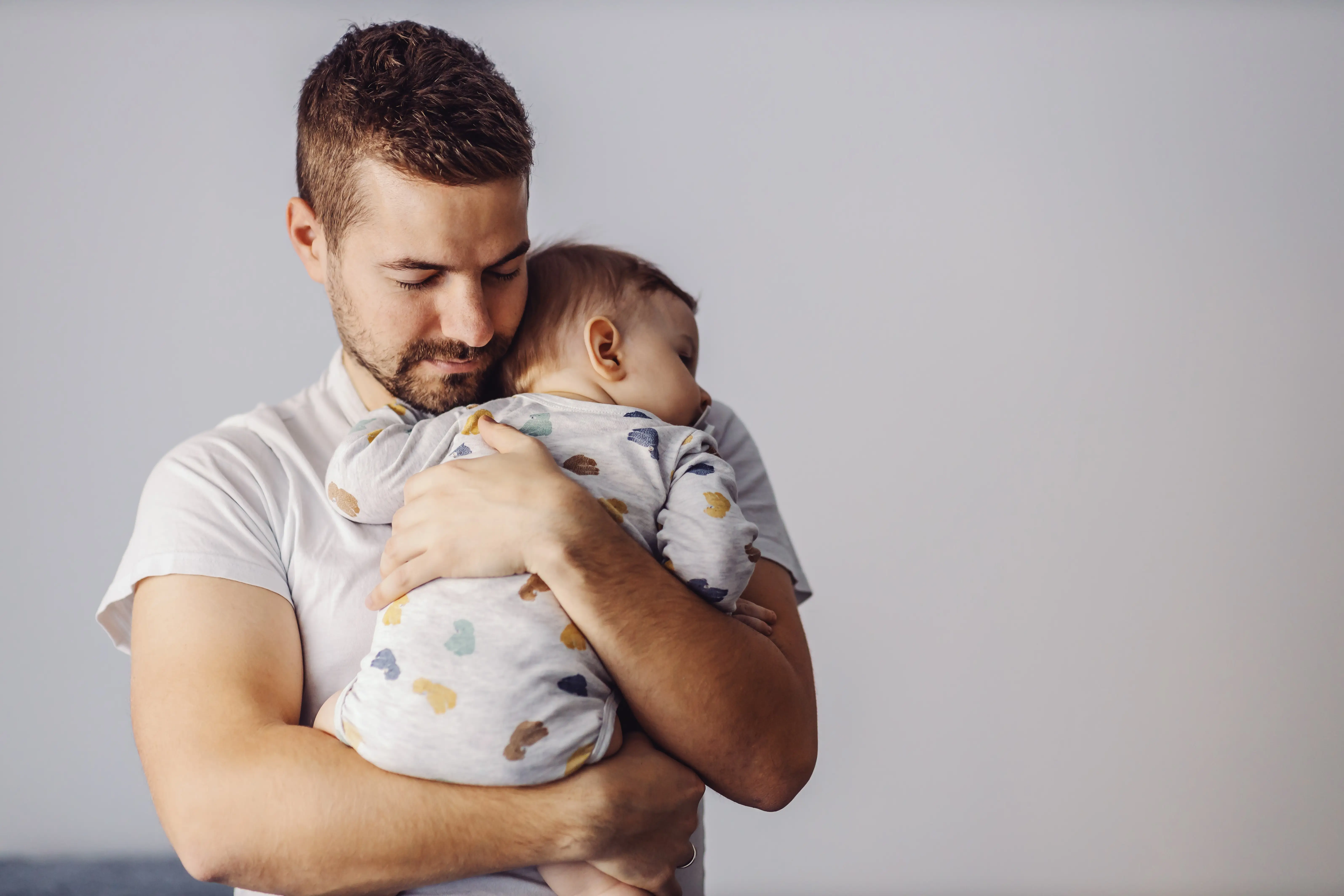 Man Holding Baby