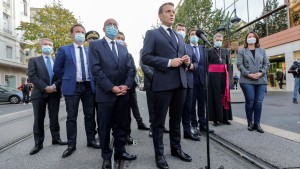 French President Emmanuel Macron speaks to the press after a knife-wielding man killed three people at the church.