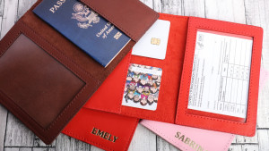 A vaccine card and passport holder