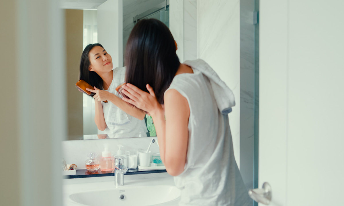 Can Brushing Your Hair Before You Shower *Really* Combat Hair Loss? Here’s What Pros Have To Say
