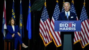 Democratic presidential candidate former Vice President Joe Biden (R) speaks as his running mate Sen. Kamala Harris (D-CA) looks on