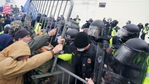 Police try to hold back protesters at the Capitol on Wednesday, Jan. 6, 2021.