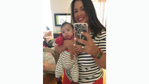 Maria Malagon at home with her son in 2017. 