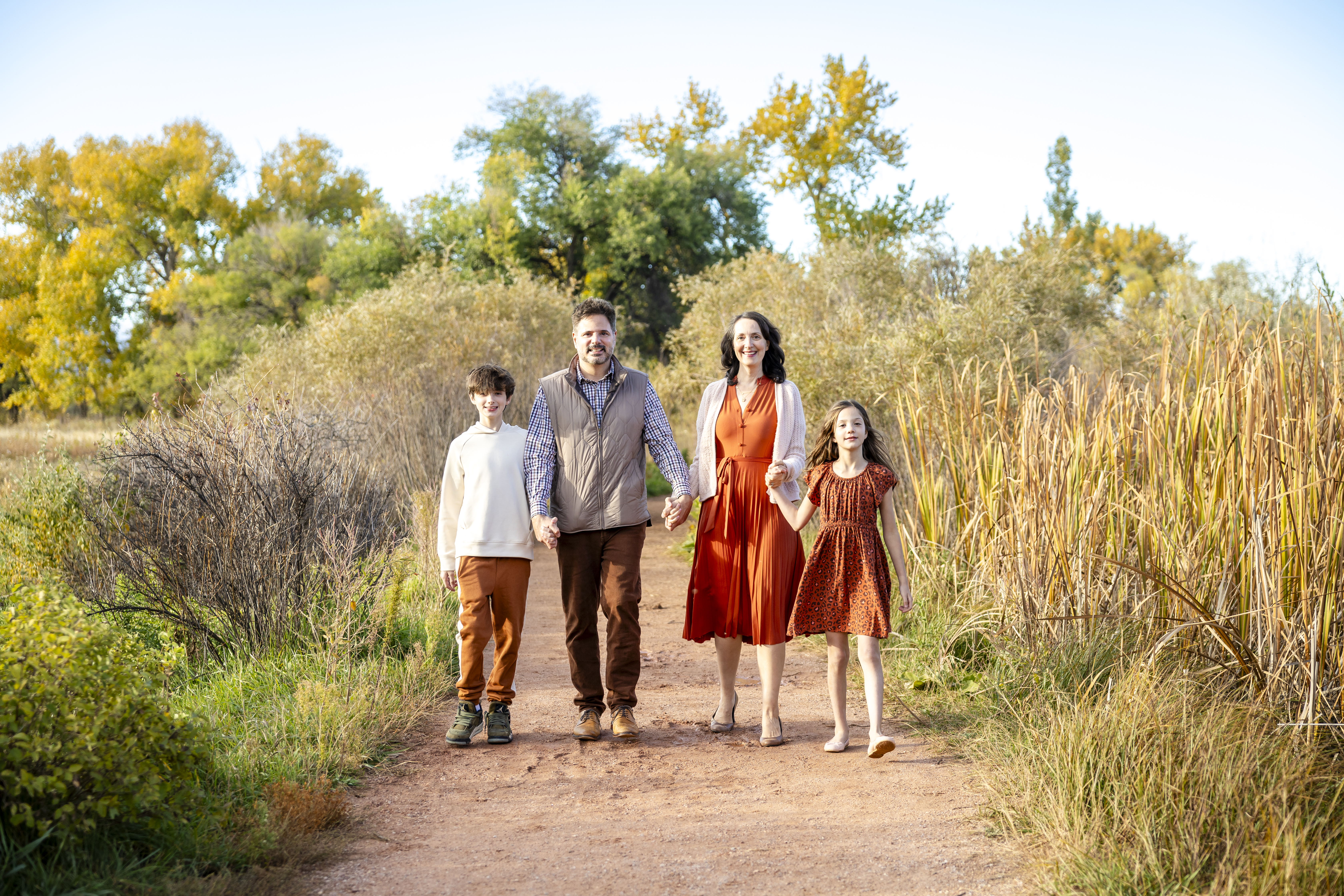 Family wearing coordinated fall outfits during an outdoor Shoott photoshoot