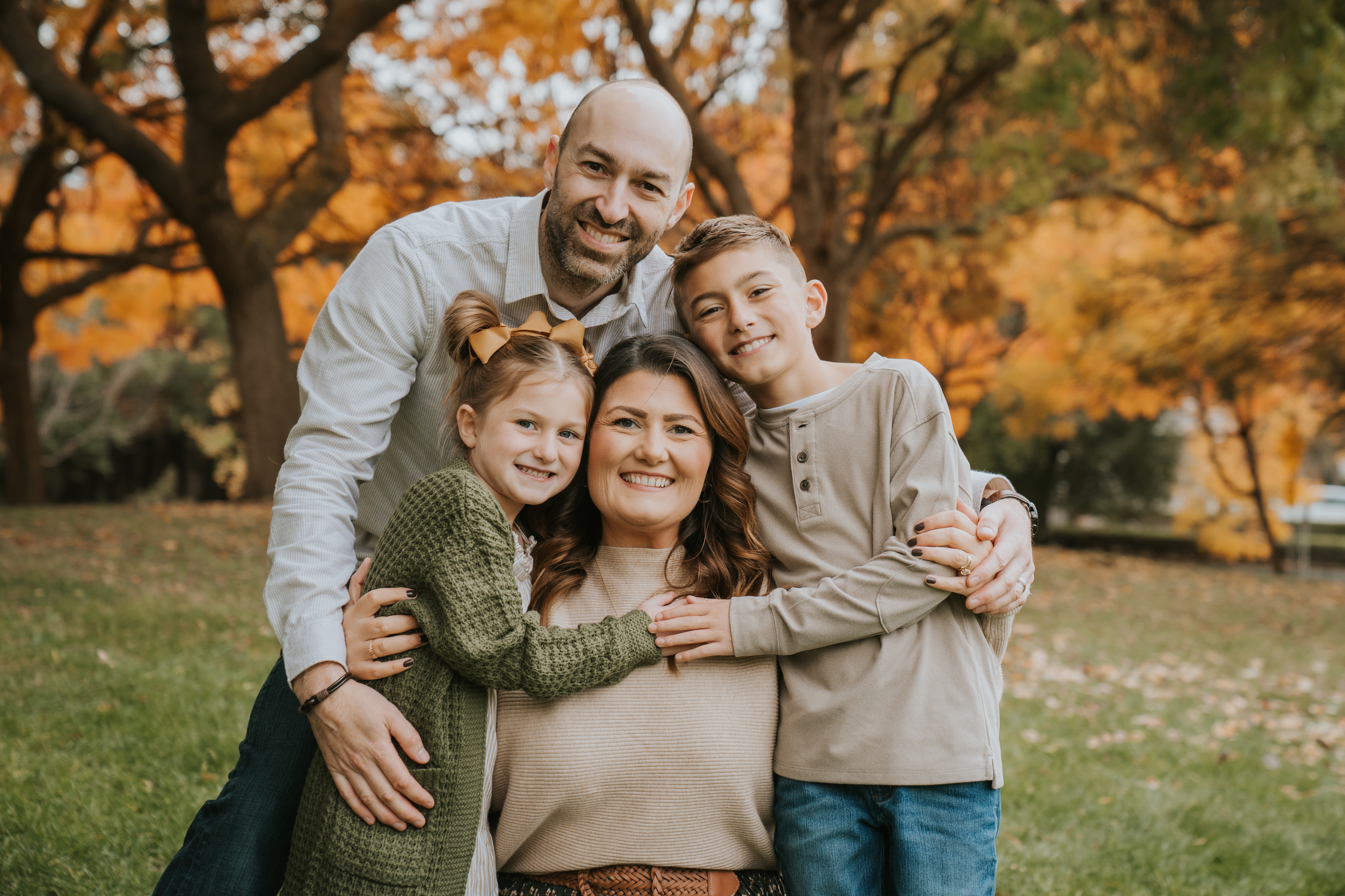 Coordinated Shoott family photo outfit color palette with sage, cream and denim.
