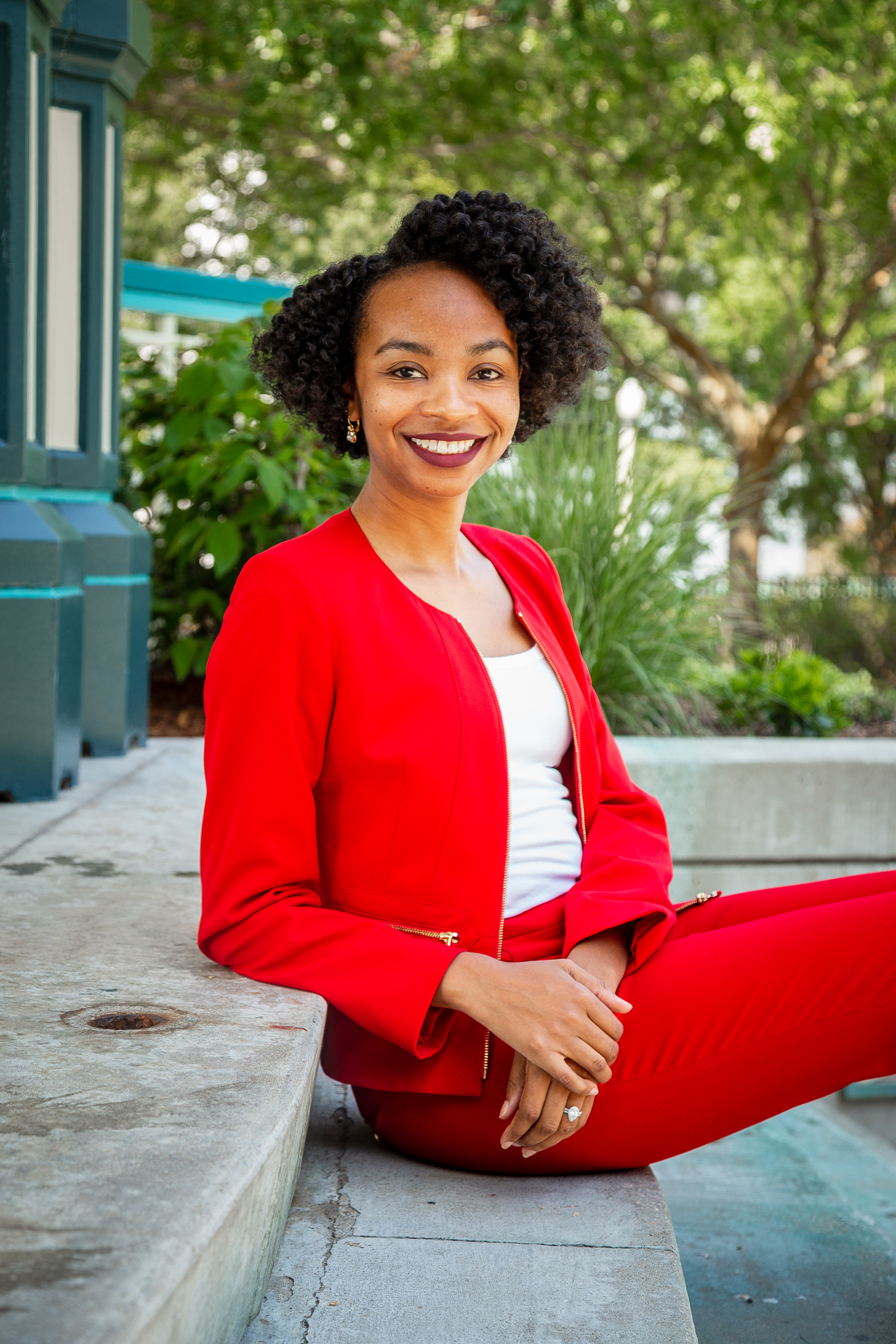 Professional during a personal branding photoshoot in front of colorful storefronts at Decatur Square, captured by a Shoott photographer.
