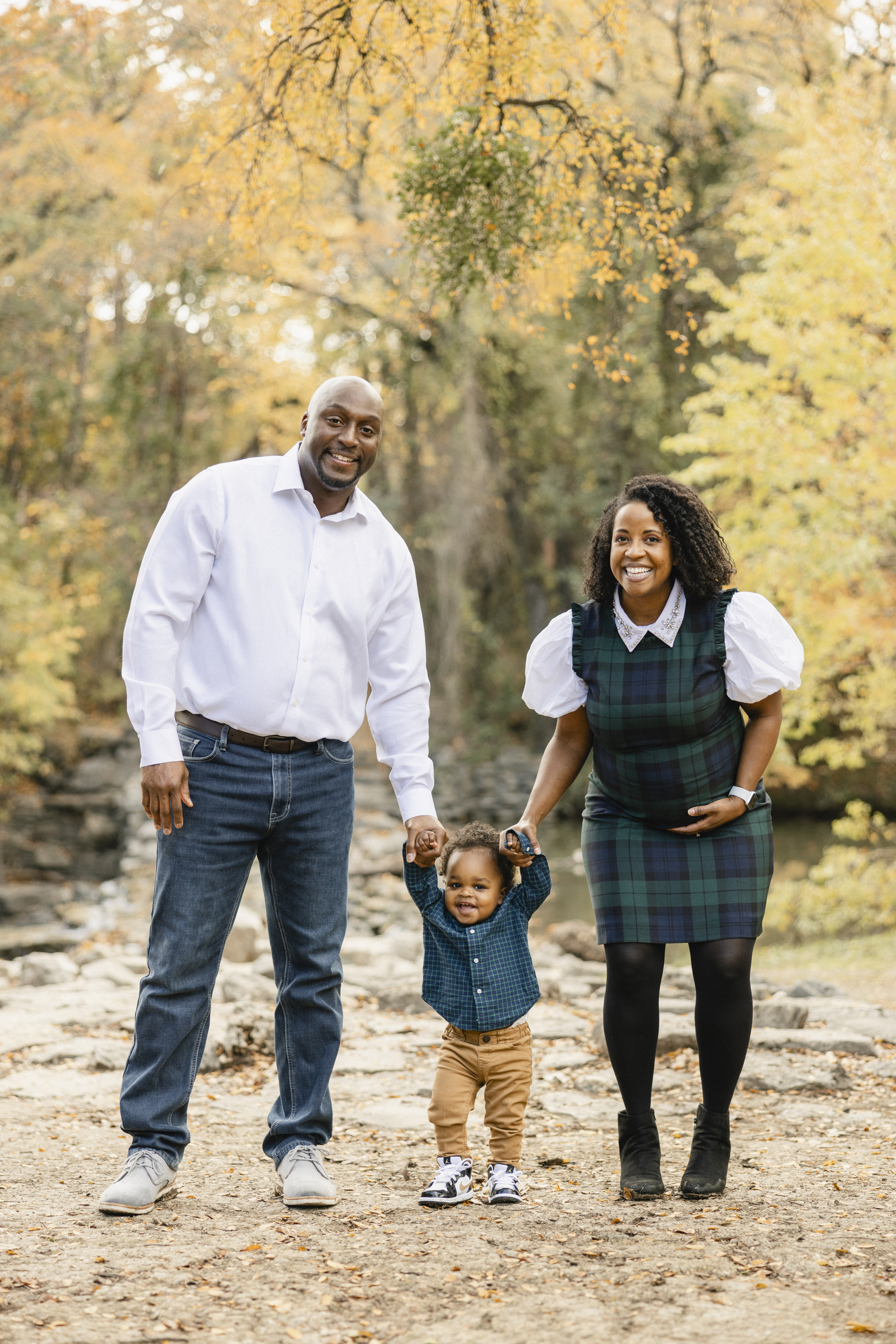 Family in coordinated fall outfits at an outdoor photoshoot location