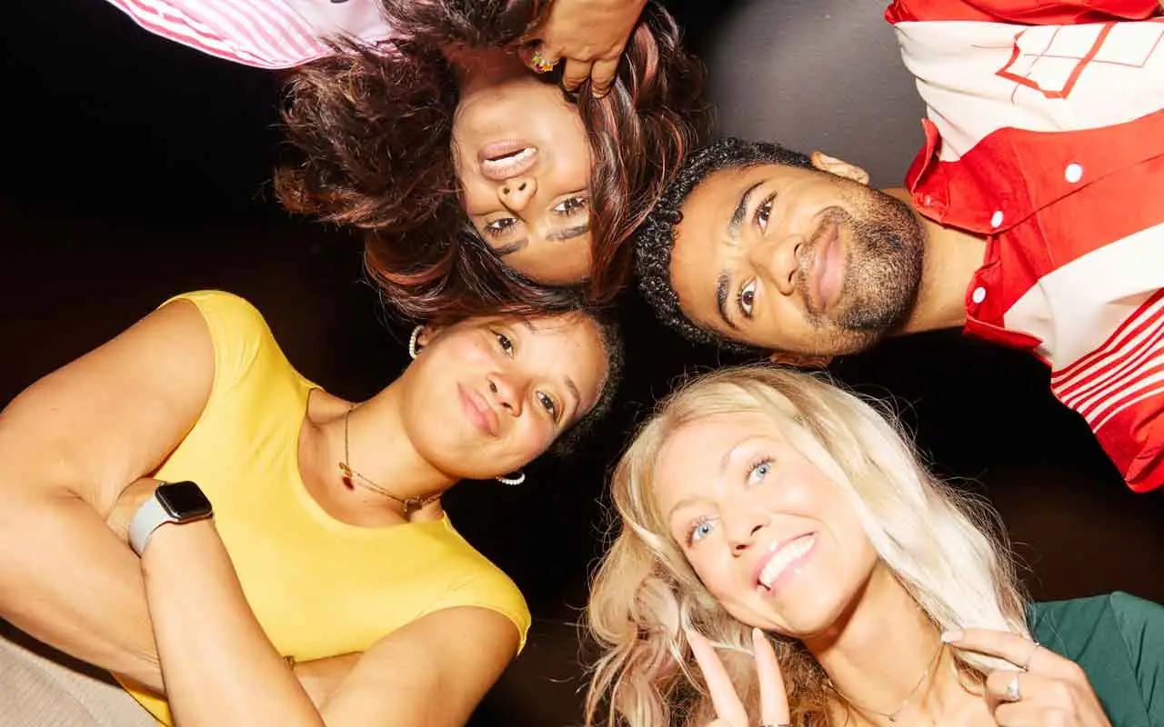 Group of friends posing together at a bowling center