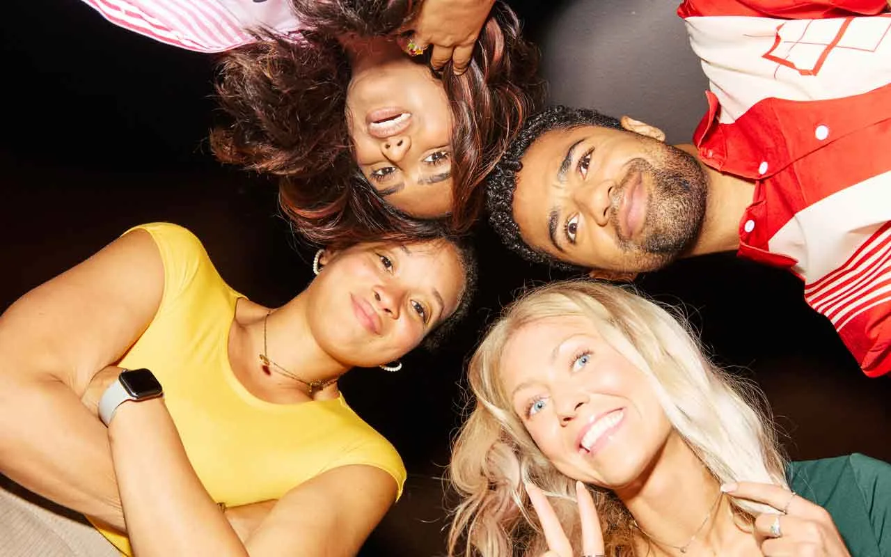 Group of friends posing together at a bowling center