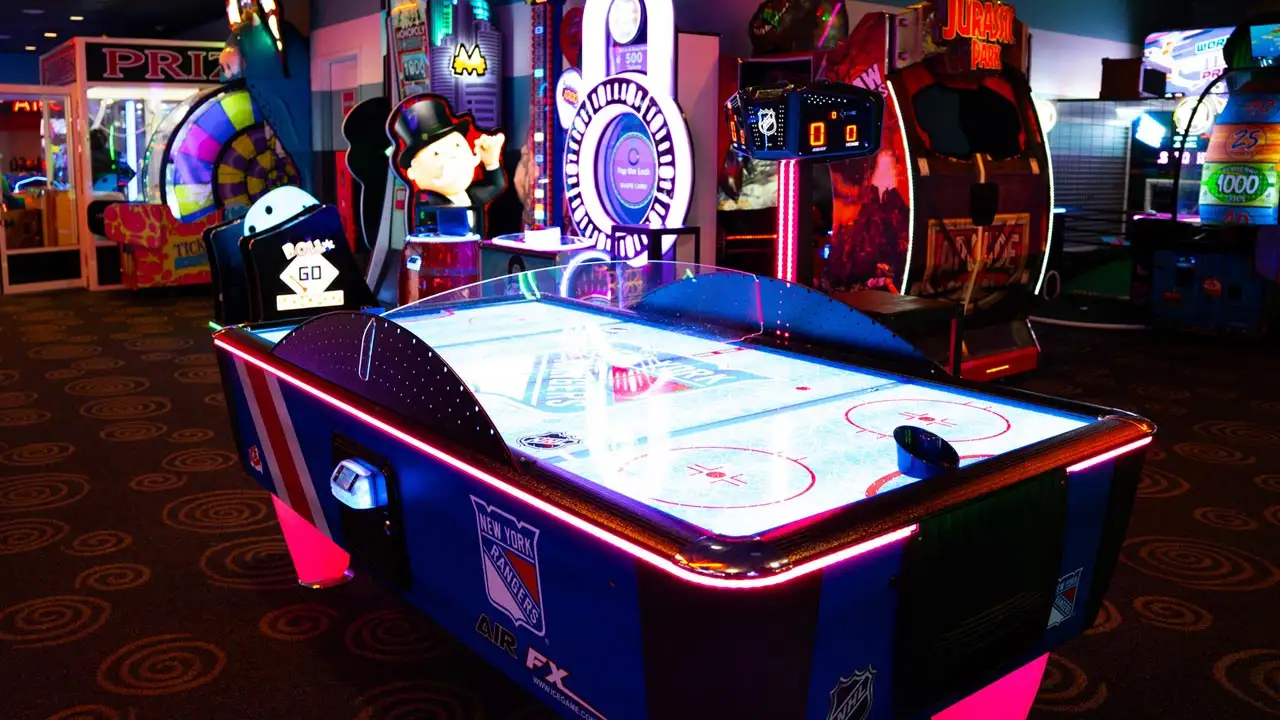 Large and colorful arcade games in a beautiful arcade room.