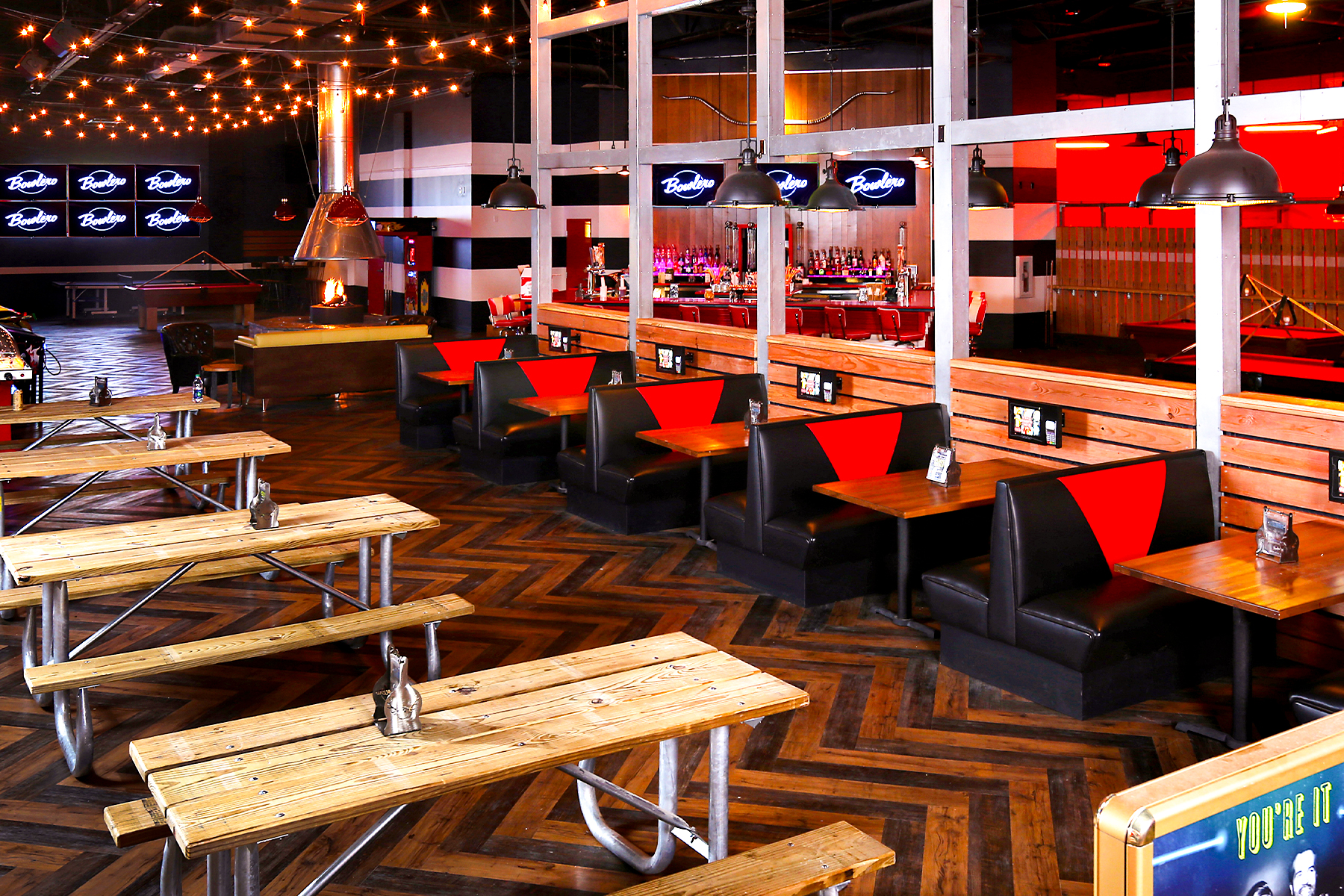 Large, beautiful eating area with big tables and lots of seating