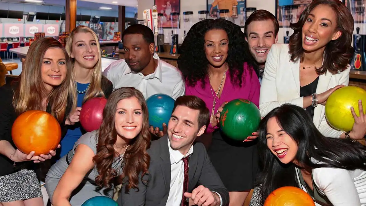 A group of coworkers posing for a picture at an AMF corporate event.