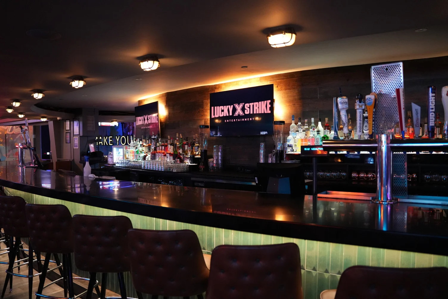 Beautiful bar with a lot of seating and a full selection of bar options.