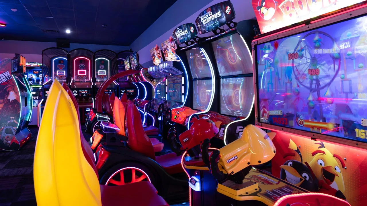 Large and colorful arcade games in a beautiful arcade room
