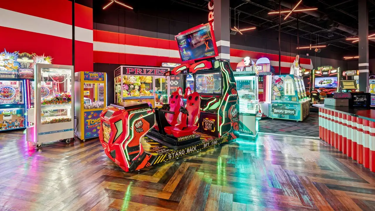 Large and colorful arcade games in a beautiful arcade room.