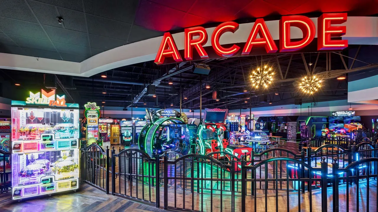 Large and colorful arcade games in a beautiful arcade room.
