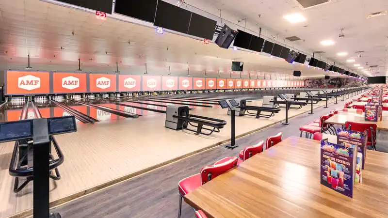 a very large and well-maintained bowling center with lots of lanes and seating.