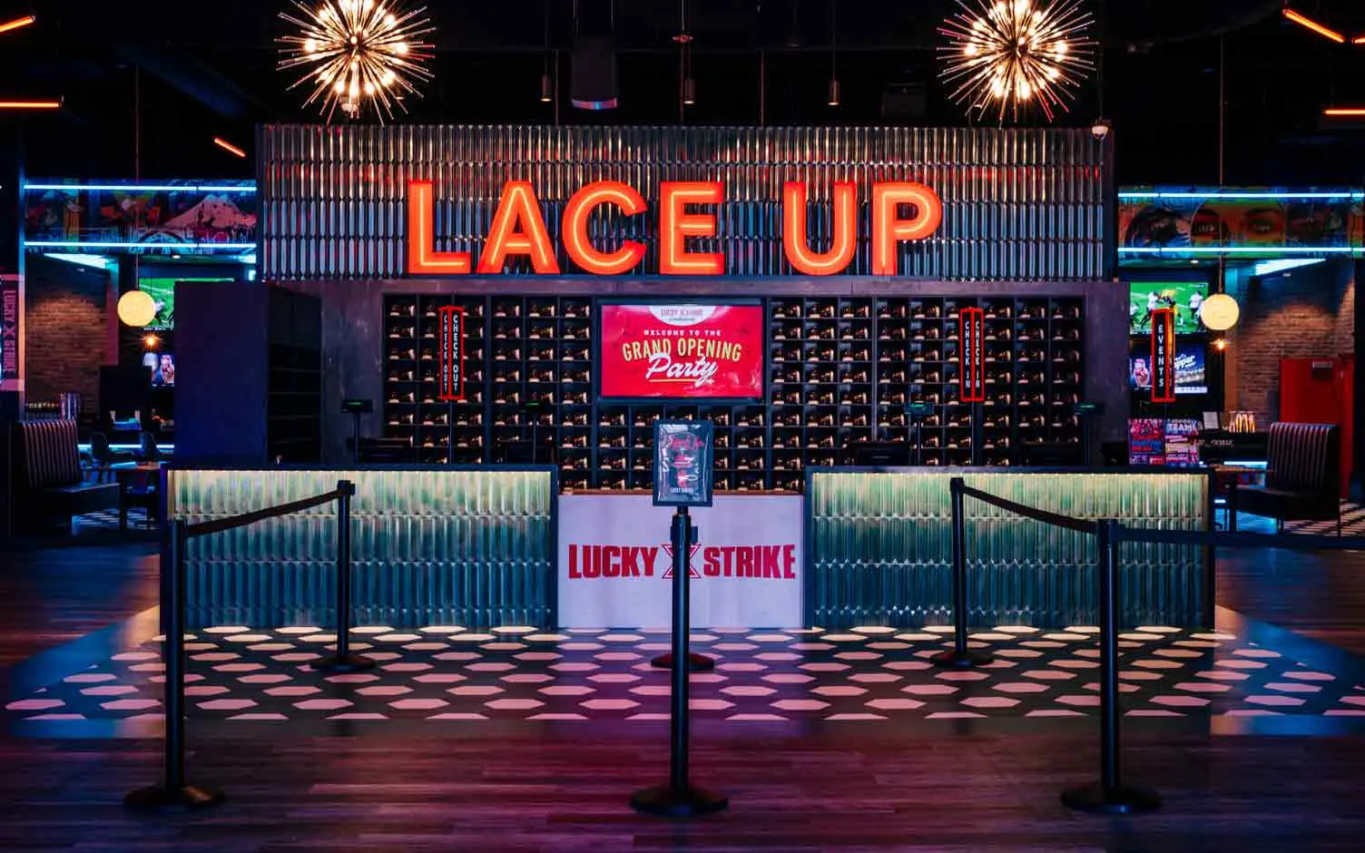 Lace Up bowling shoe check-in counter with neon signage and Lucky Strike branding at Lucky Strike Southlands