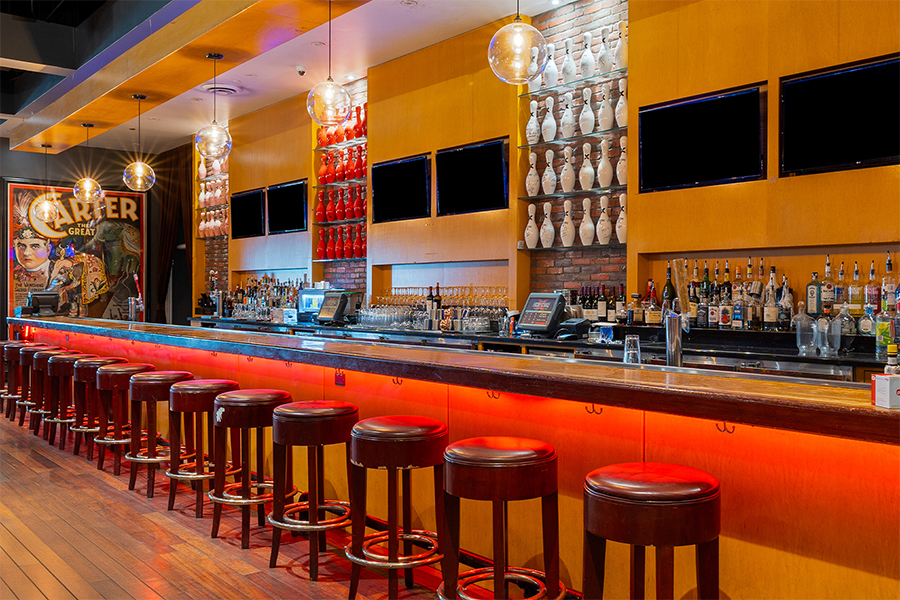Large, beautiful bar with lots of seating and big TVs