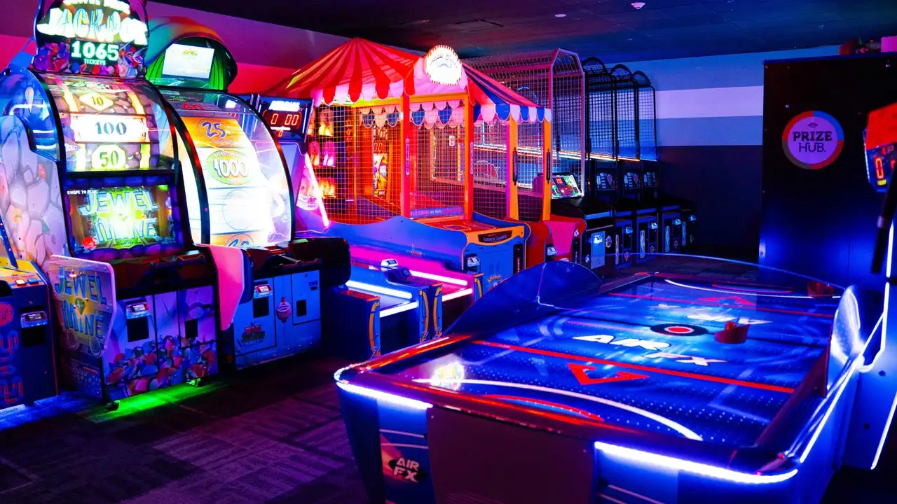 Large and colorful arcade games in a beautiful arcade room.
