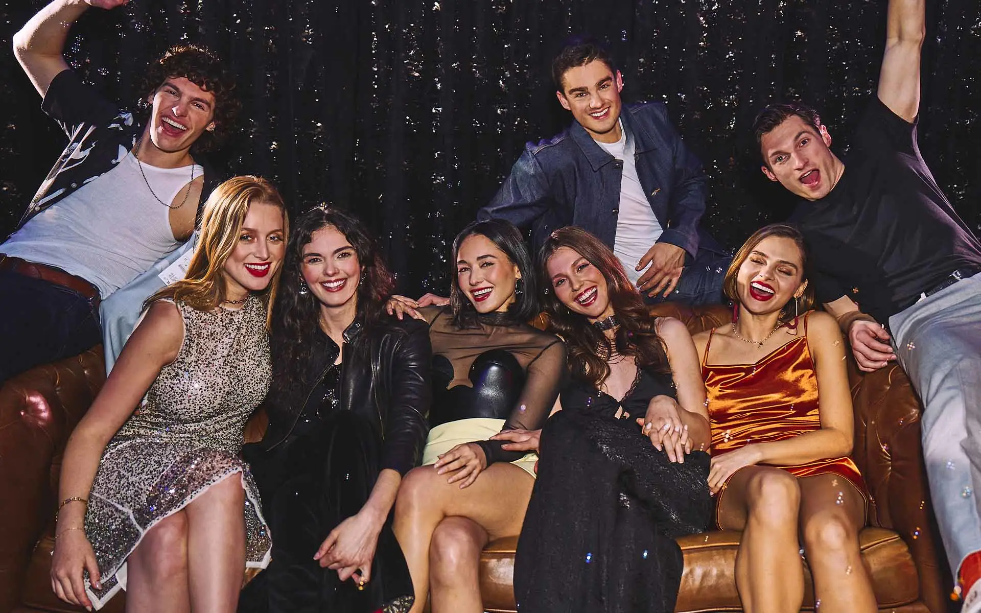 Group of friends celebrating and having fun in a lounge