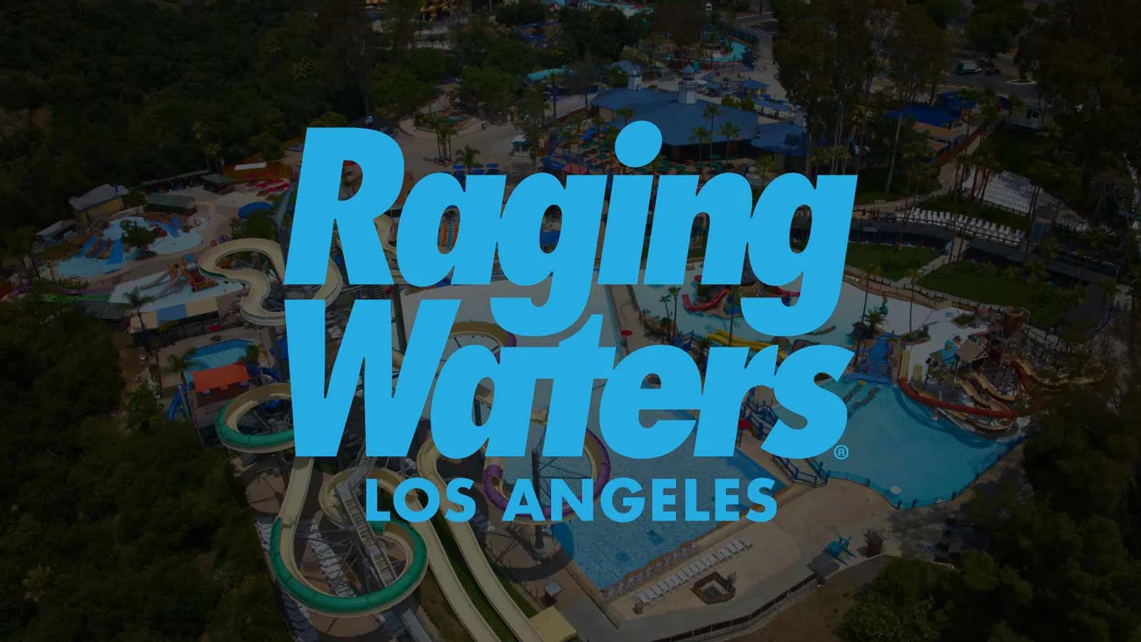 Aerial view of Raging Waters Los Angeles waterpark with pools, slides, and attractions visible beneath the logo.