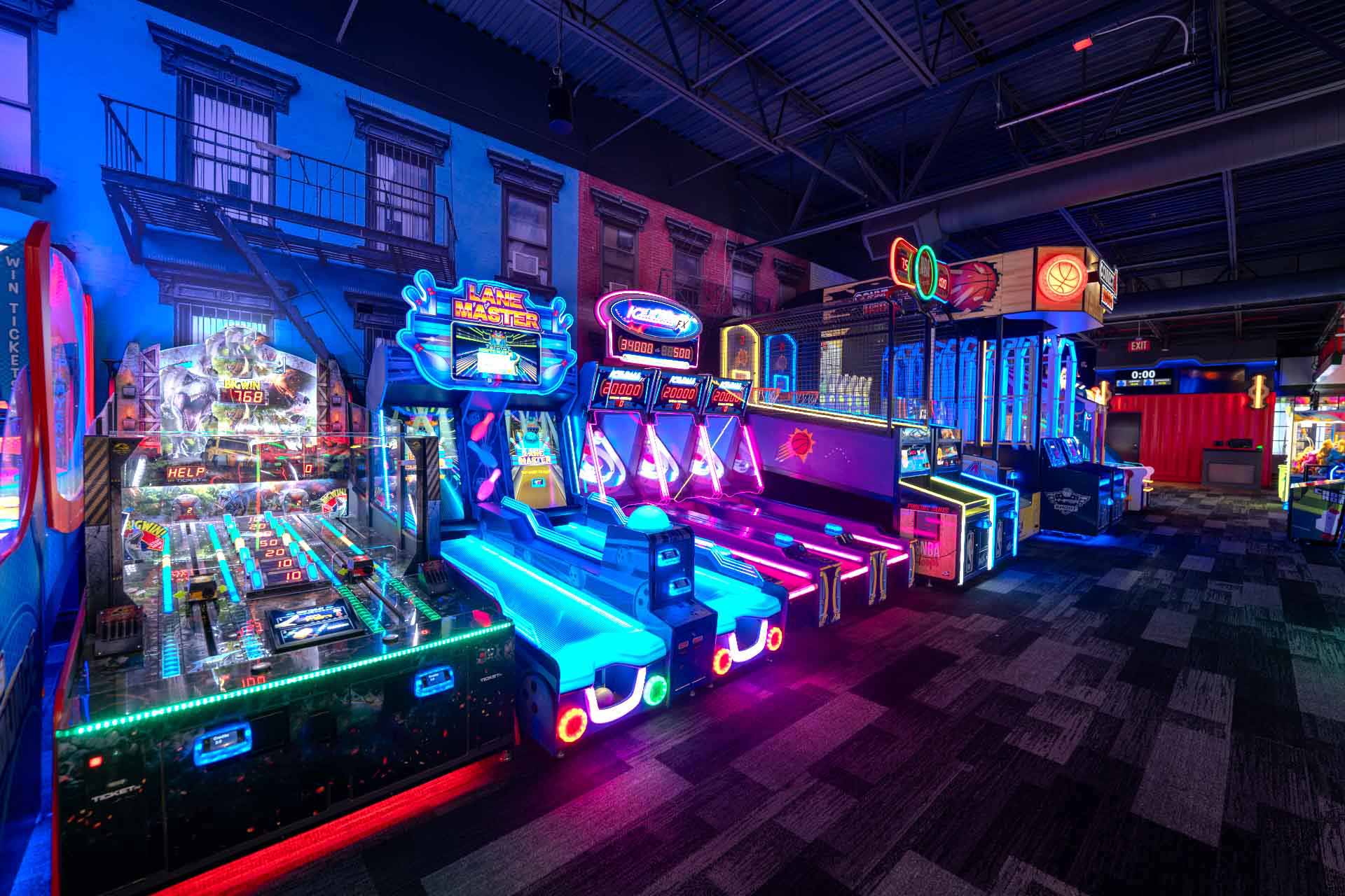 Colorful arcade games at Mavrix Entertainment Center featuring interactive attractions and neon lighting.