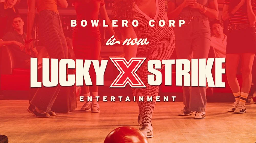 Bowlero Corporation rebrand announcement graphic reading “Bowlero Corp is now Lucky Strike Entertainment” over a red-toned image of people bowling at an upscale bowling venue.