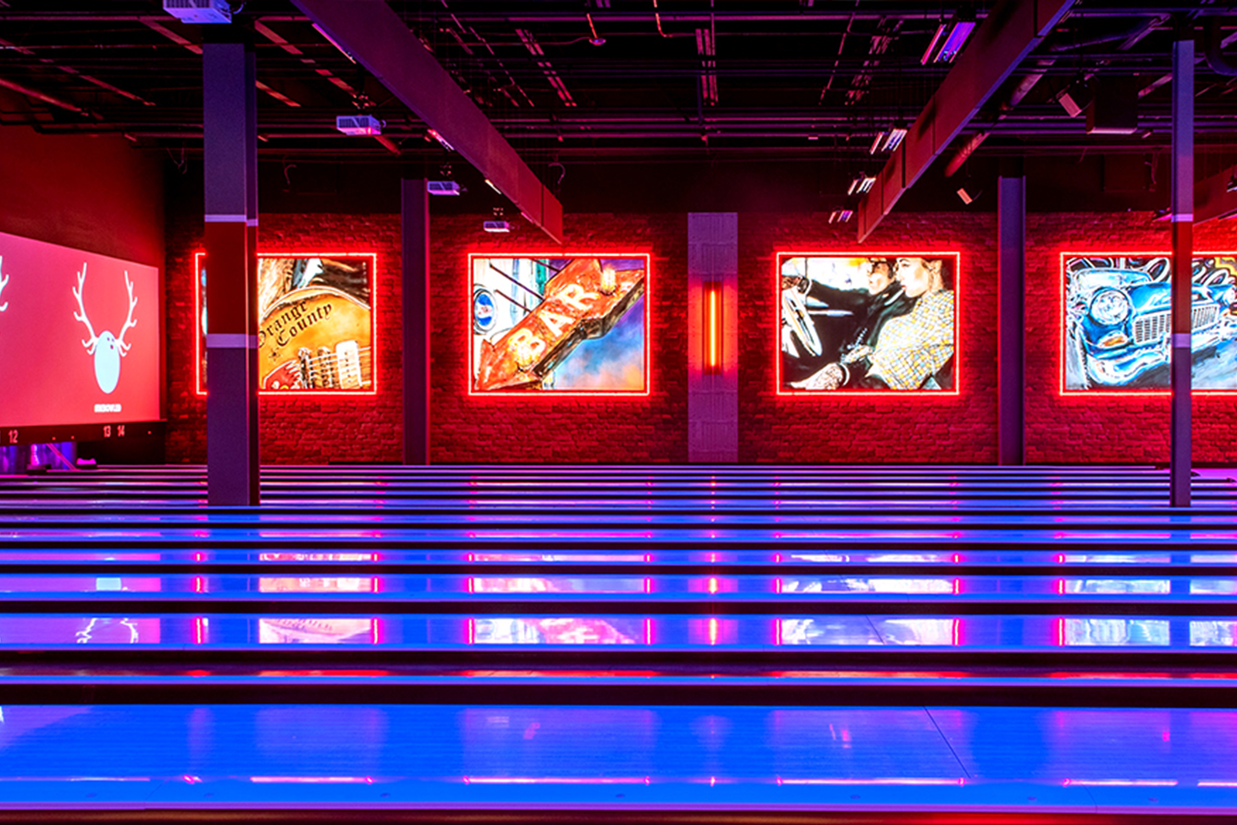 Beautiful bowling center with lots of black light lanes and large neon signs