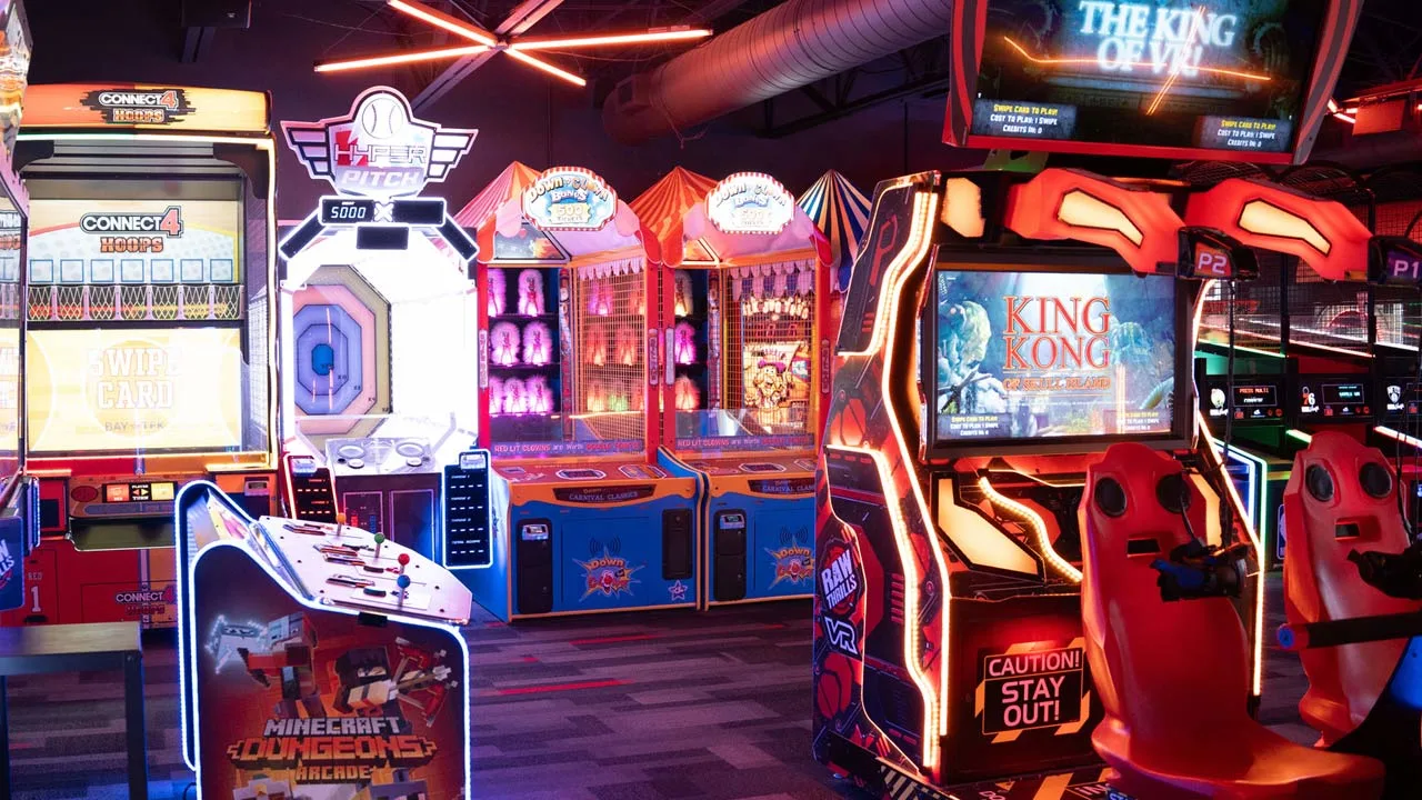Large and colorful arcade games in a beautiful arcade room.