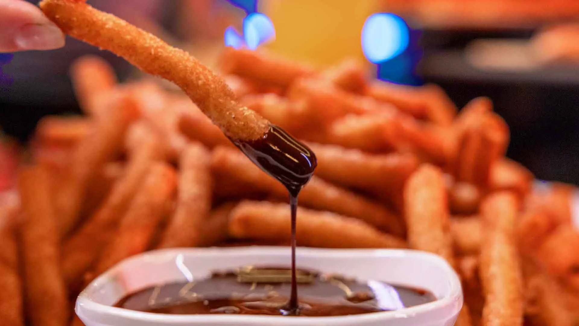 Funnel cake fries dipped in rich chocolate sauce served as a premium dessert option for catered events.