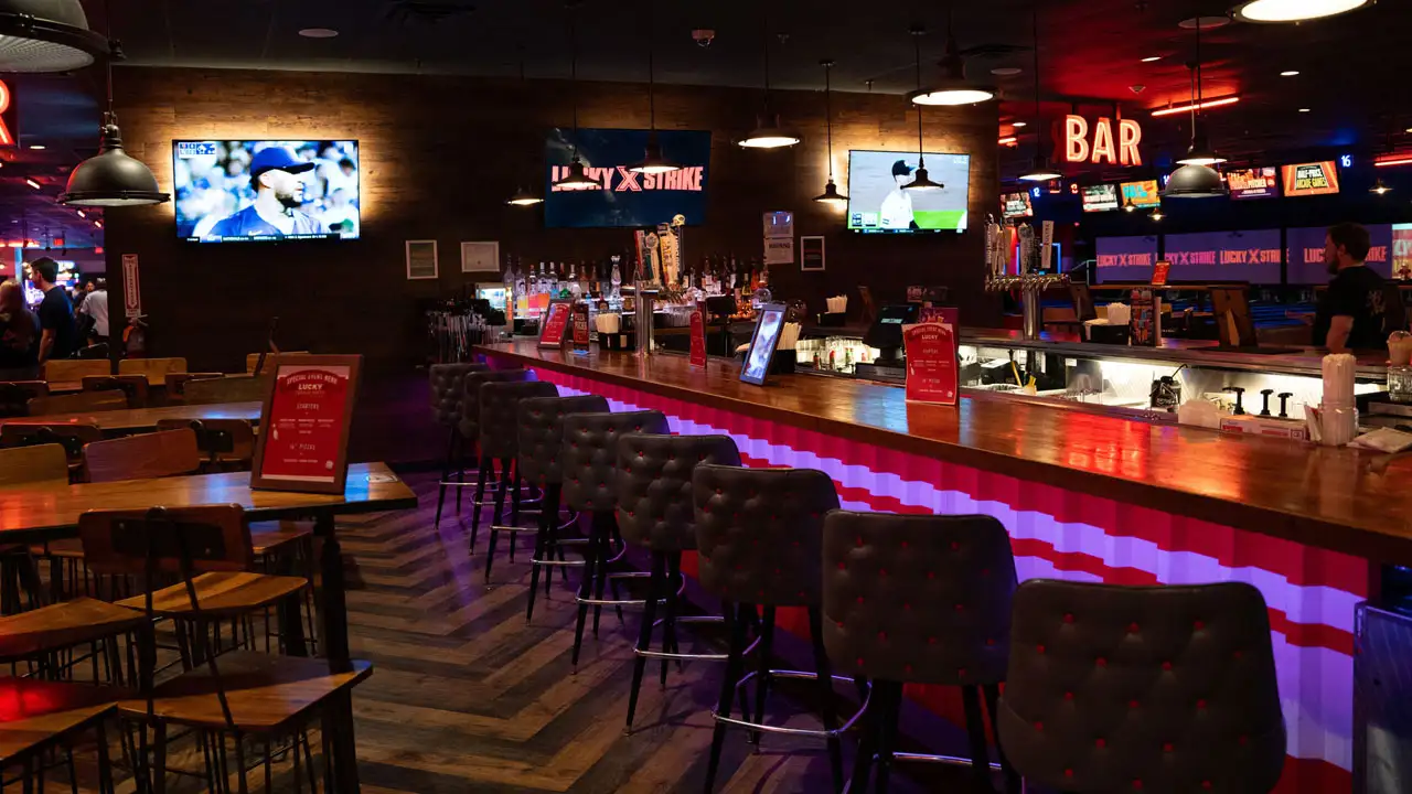 Beautiful bar and lounge area with ample seating and space.