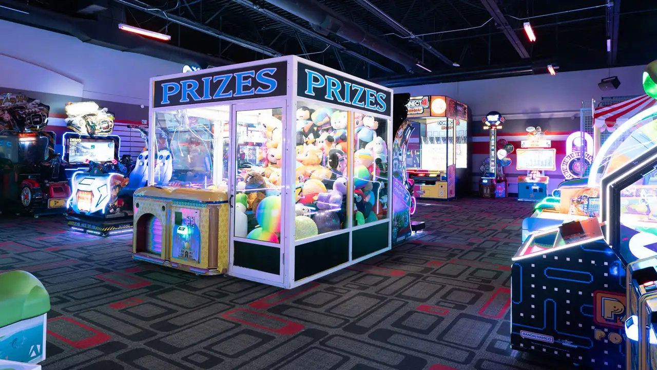 Large and colorful arcade games in a beautiful arcade room.