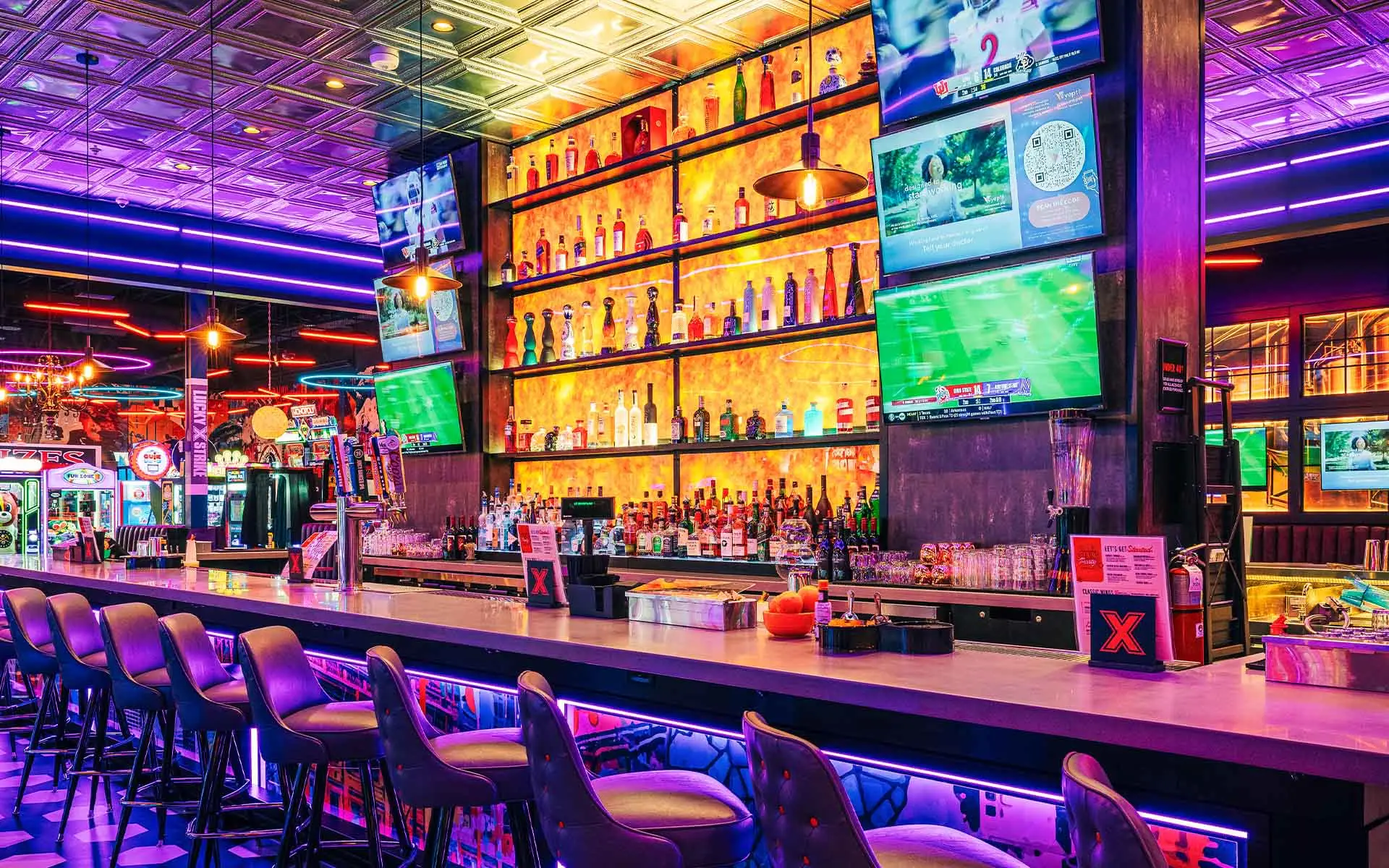 Beautiful, large, and well-stocked bar with lots of seating and TVs