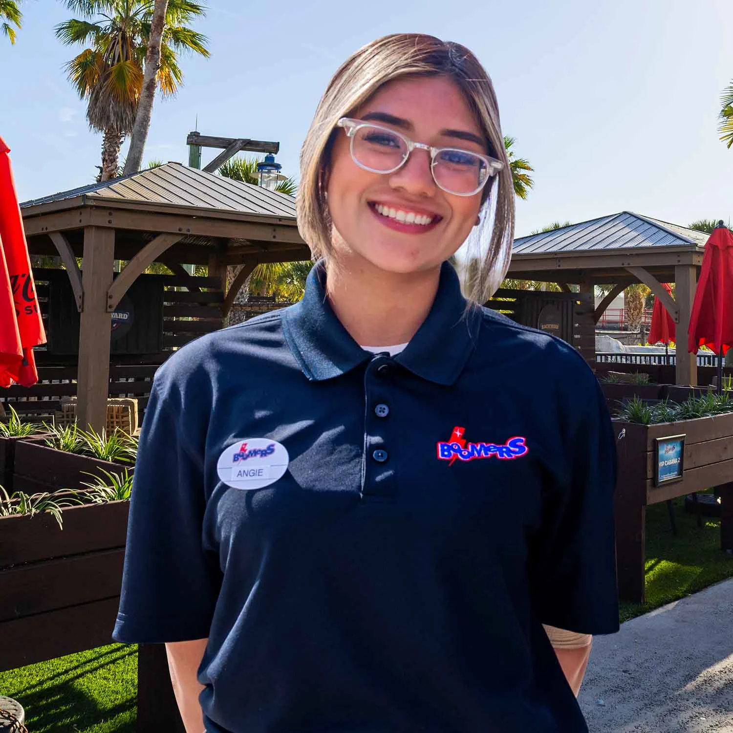 Manager standing outdoors, highlighting field management careers at Lucky Strike Entertainment.