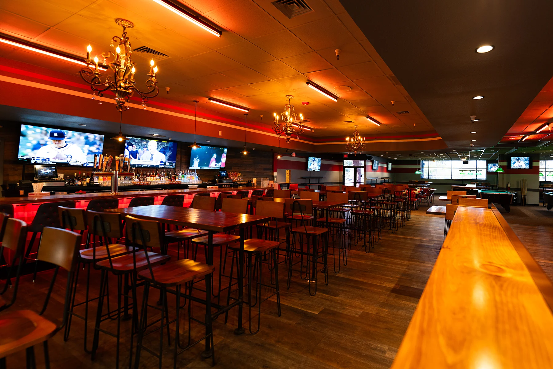 Beautiful bar area with lots of seating and tables.