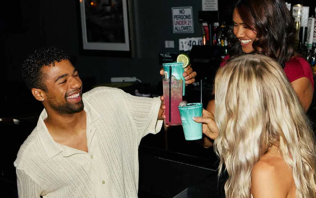 Friends cheersing cocktails at the Lucky Strike bar.